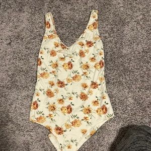 Yellow and cream floral bodysuit never worn